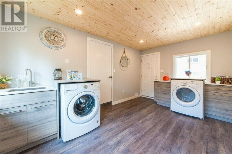 Bright laundry room with clean white walls
