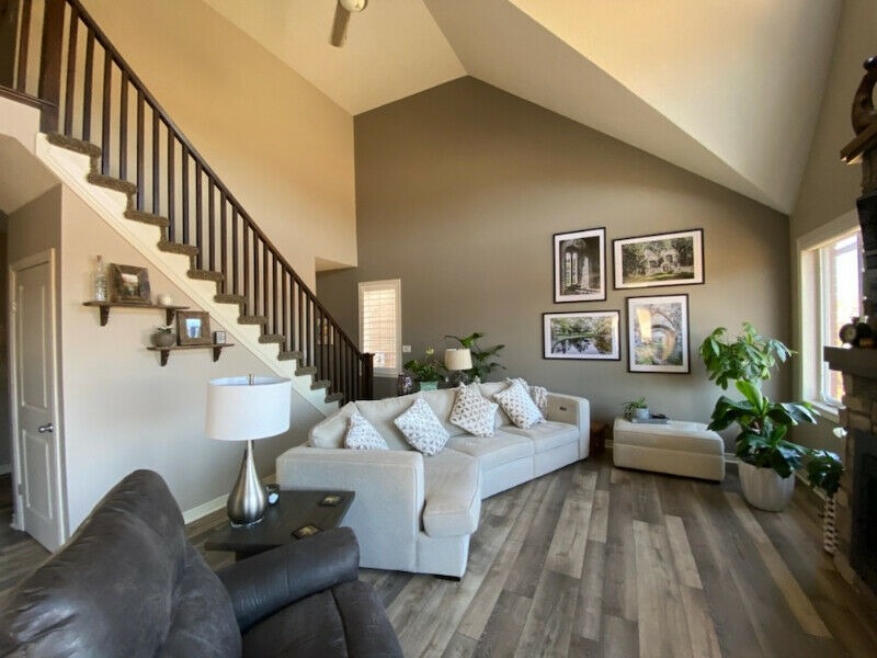 Vaulted living room with warm taupe accent wall