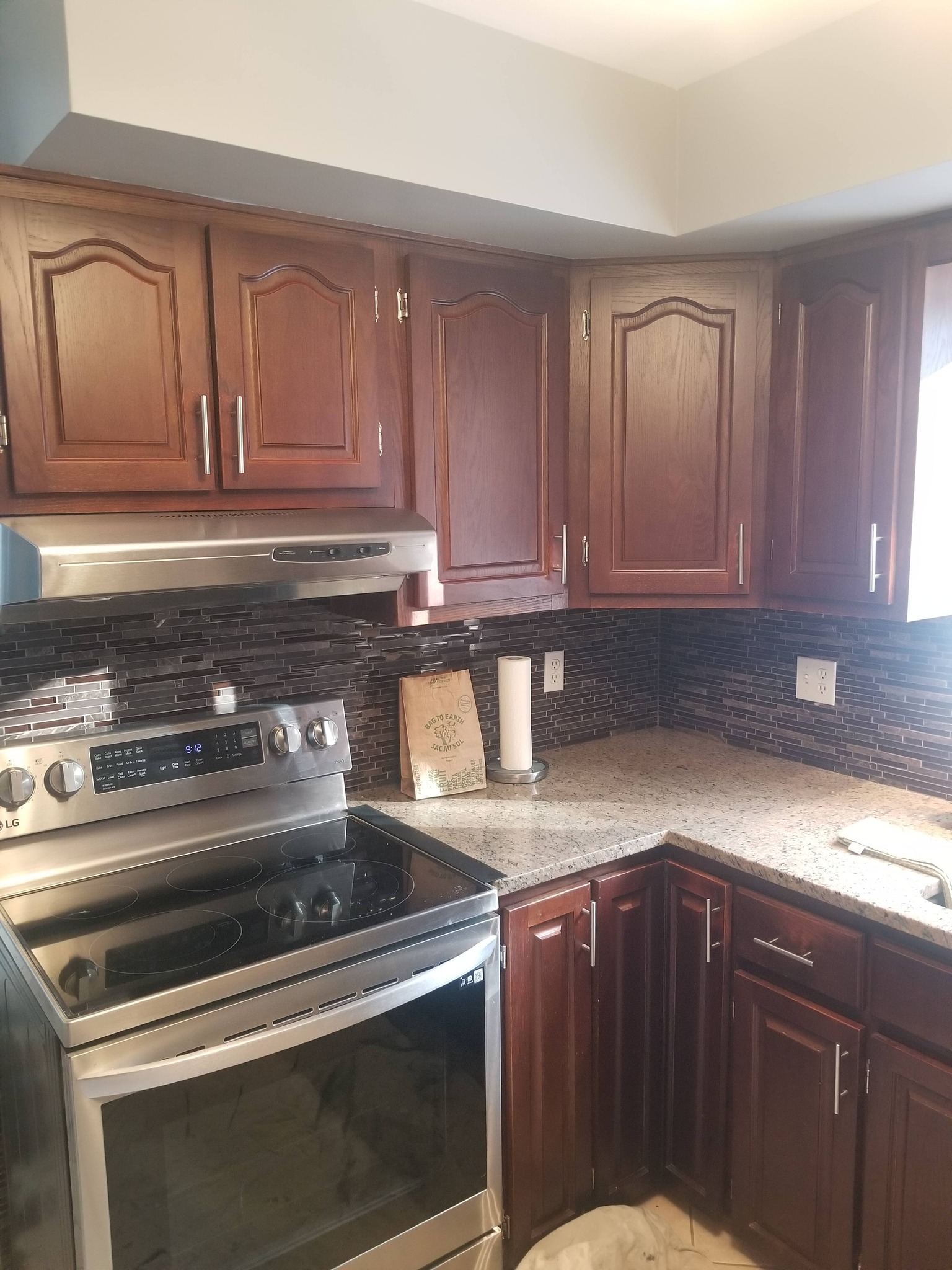 Before: Original dark wood kitchen cabinets