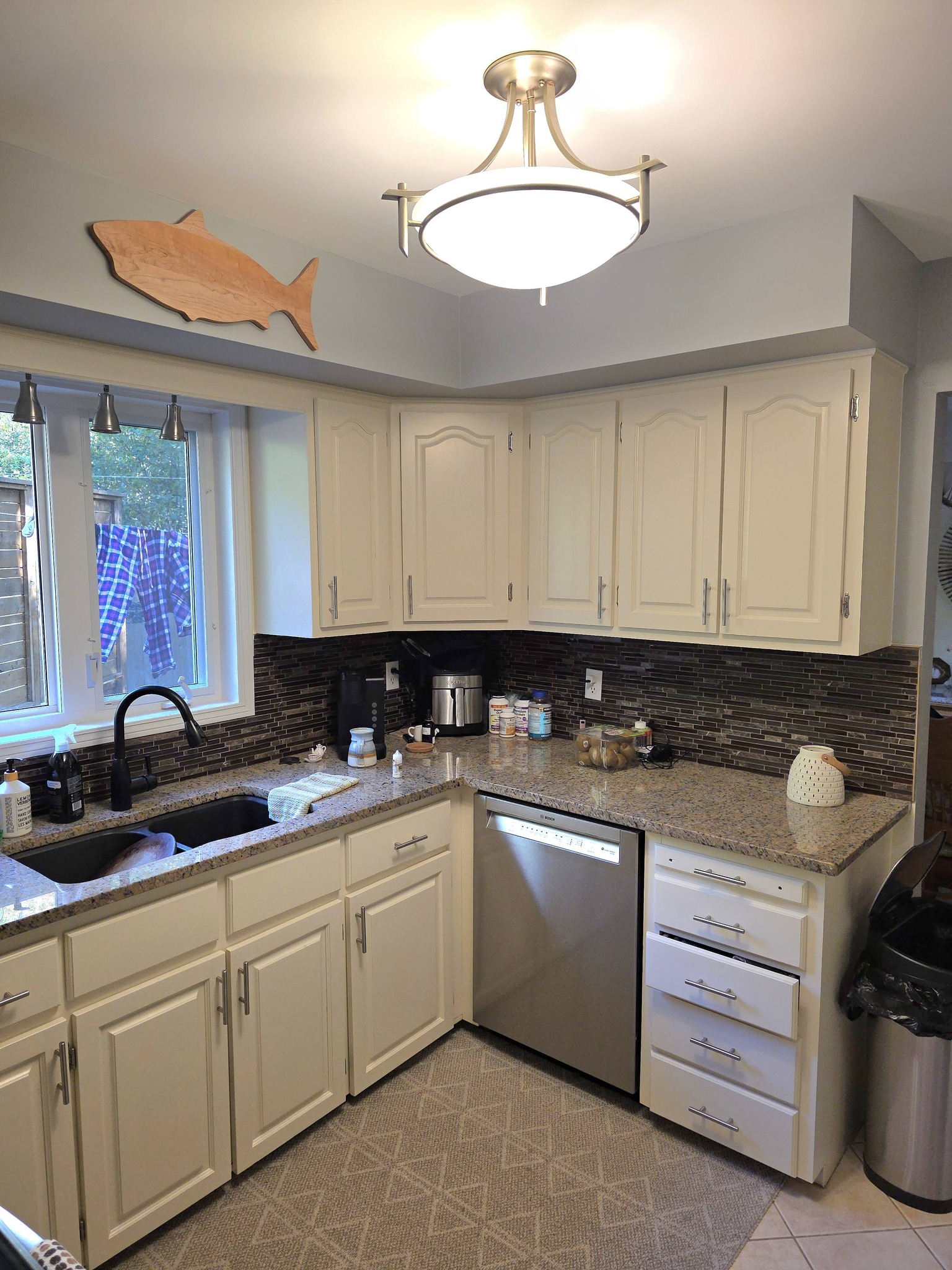 After: Kitchen with bright white cabinets