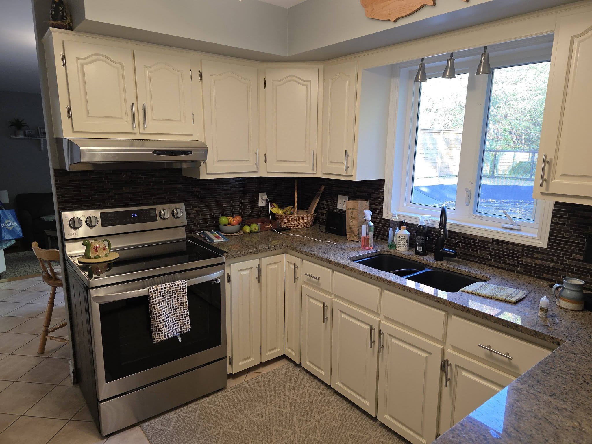 After: Kitchen cabinets painted white