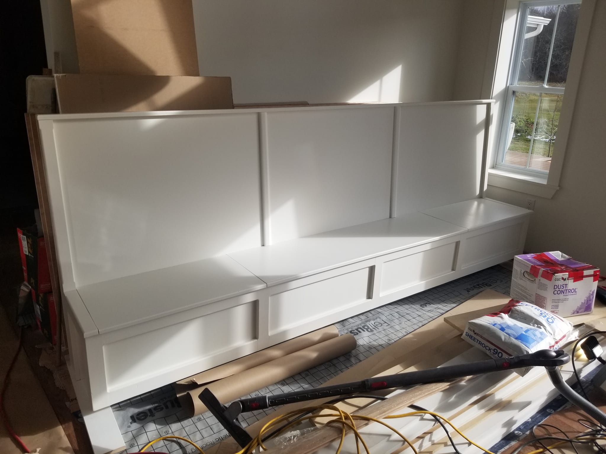 Custom built-in bench with white paint finish