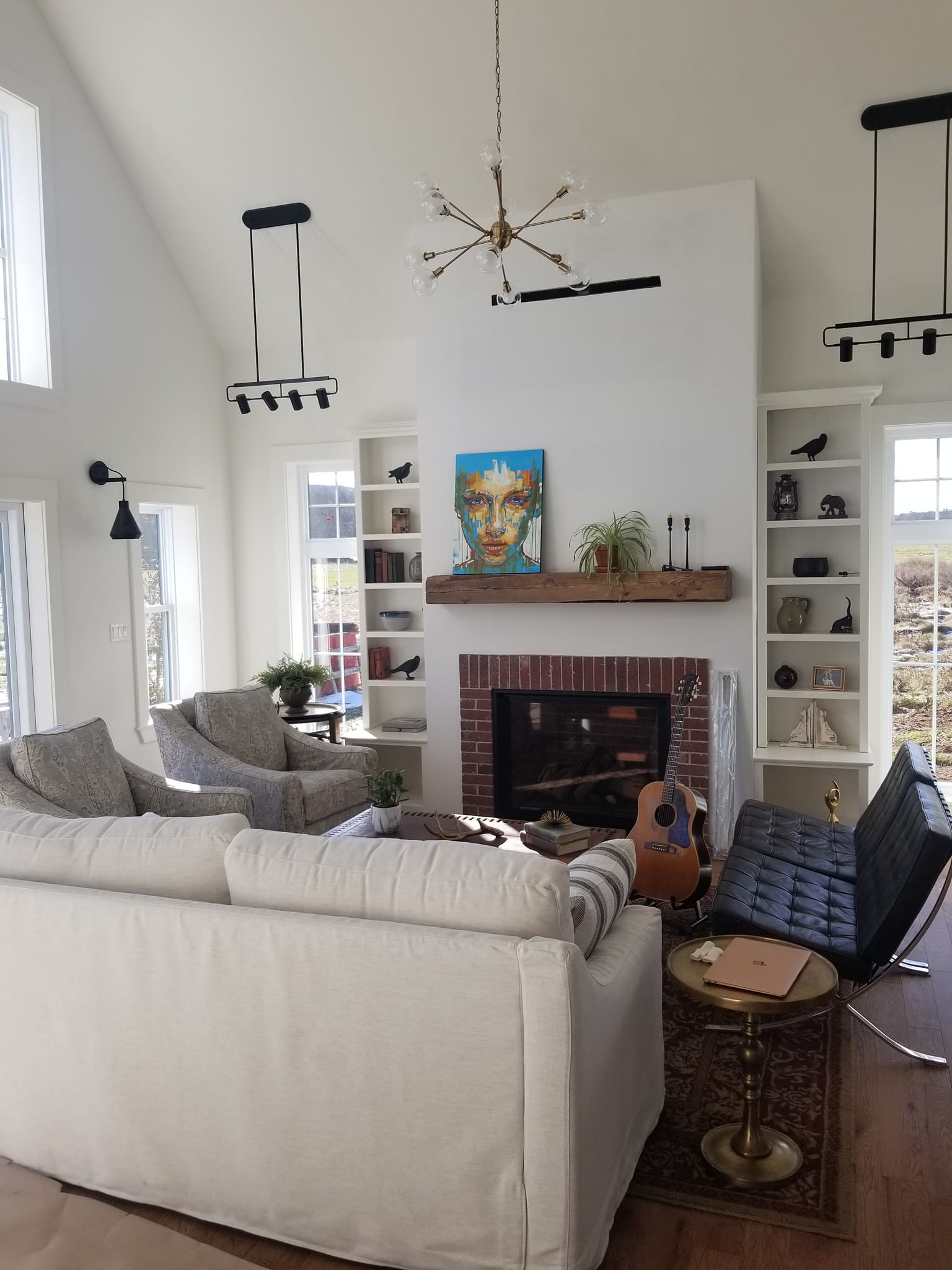 Beautiful living room with custom built-ins painted by Stewart & Co.
